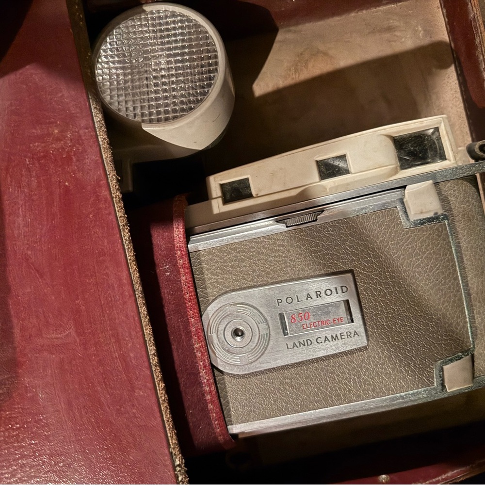 Polaroid Land Camera with Red and Gray Accents